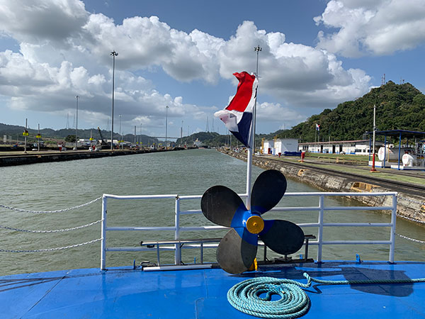 view of back of boat passing through Panama Canal