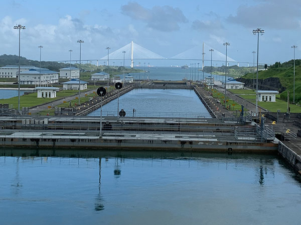 Bridge in distance while passing into Panama Canal